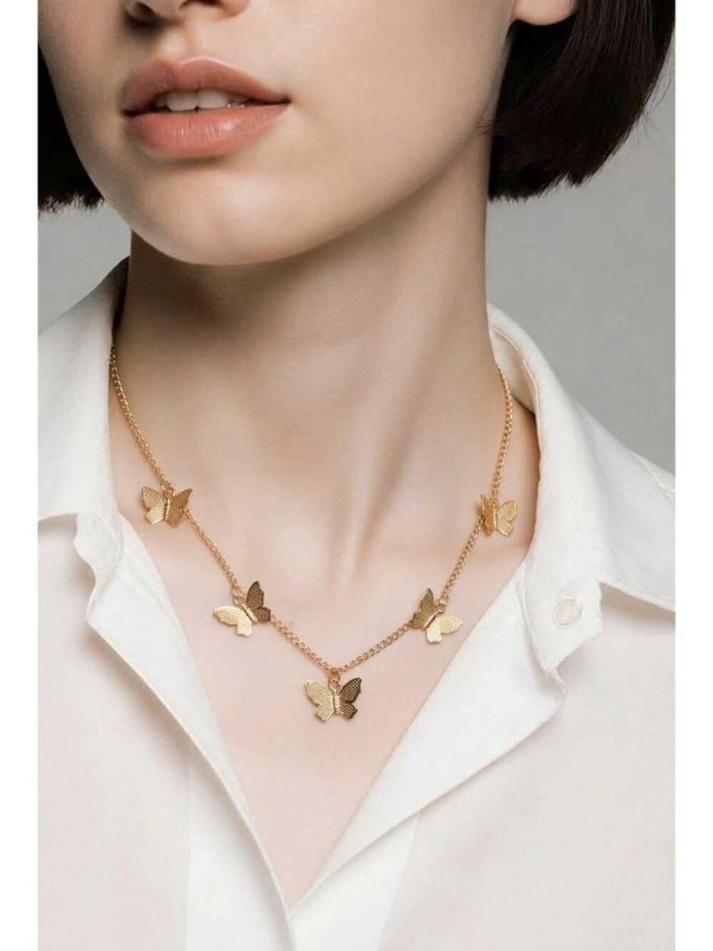Gold-tone butterfly charm necklace